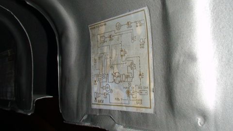 1979 Ford Bronco - A vacuum routing diagram sticker is affixed to the interior panel of a vehicle.