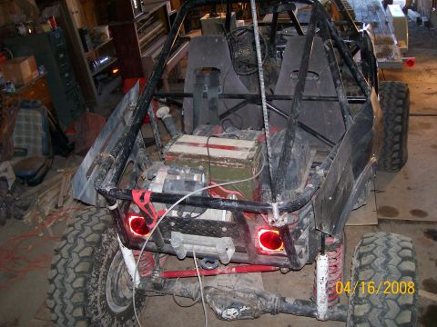 1984 Ford Bronco - This custom buggy features a prominent roll cage, large off-road tires, and a winch mounted on the rear.