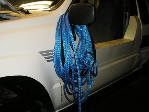 1986 Toyota Hilux - Blue winch line hangs from the side mirror of a 1986 Toyota Hilux.