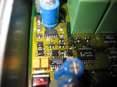 1995 Ford C-350 (Centurion Conversions) - A detailed view of electronic components on a circuit board, including integrated circuits and capacitors.