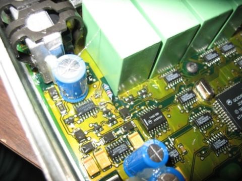 1995 Ford C-350 (Centurion Conversions) - Electronic circuit board with various components visible, including capacitors and chips.