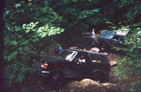 1988 Ford Bronco - Me climbing up Fain's Ford. That's Lance in the background pulling his busted rear drive shaft. But it made a pretty Rose for Michelle.
