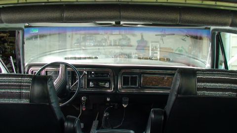 1979 Ford Bronco - Interior view of a vehicle's dashboard, displaying a map.