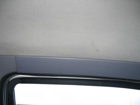 1995 Mercury Cougar - Interior view of a car's headliner and window trim, with a watermark visible.