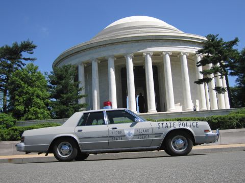 1991 Ford LTD Crown Victoria - low-angle shot of a gray Rhode Island State Police sedan parked before the columned, domed Jefferson Memorial.