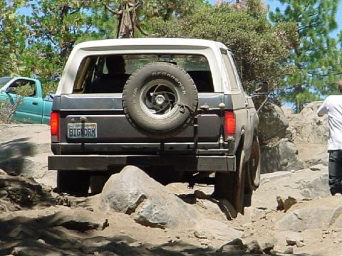 1986 Ford Bronco - skidplates and armor recomended. (I smashed a tranny pan on this hill.) :)