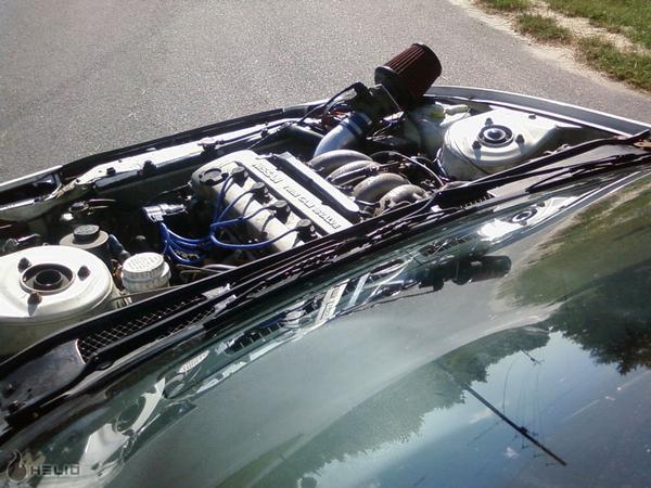 Engine bay with Nissan engine and aftermarket air intake
