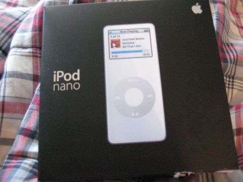 1996 Ford Bronco - Packaging for an iPod Nano device is shown on a plaid surface.
