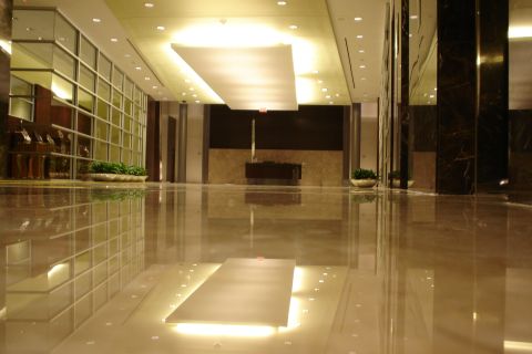 1994 Ford Bronco - A wide-angle view of a building lobby, emphasizing the reflective floors and architectural elements.