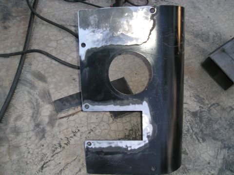 1986 Toyota Hilux - A close-up of a metal component, possibly a fender or trim piece, shows signs of repair and preparation.