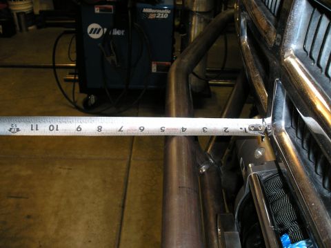 1986 Toyota Hilux - Measuring metal tubing near a Miller welding machine.