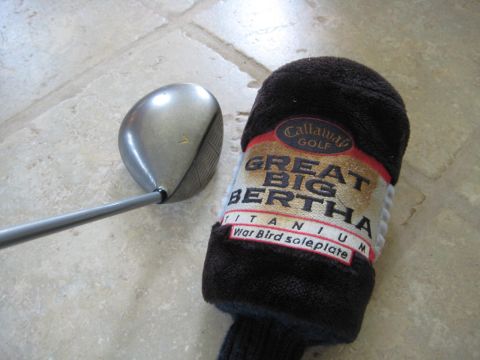 1993 Ford Probe - A Callaway Great Big Bertha Titanium golf club with its headcover is shown on a tiled floor.