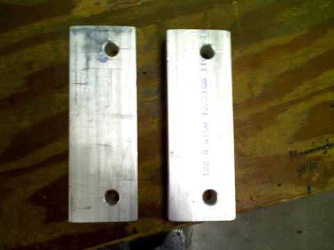 1998 Jeep Cherokee - Two metal plates are shown, one with etched text, against a wooden surface.