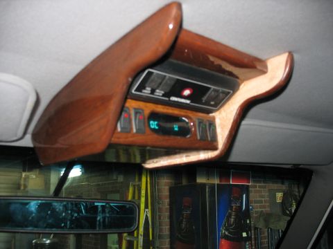 1995 Ford C-350 (Centurion Conversions) - The vehicle's interior features a custom overhead console with multiple switches and a digital display.