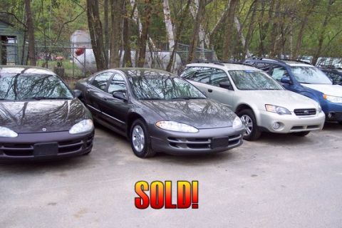 2001 Ford Crown Victoria - Several cars are parked in a lot, with a prominent "SOLD!" graphic overlaid on the image.