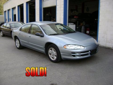 2001 Ford Crown Victoria - A silver Dodge Intrepid is parked in front of a garage, with a "SOLD!" graphic superimposed on the image.