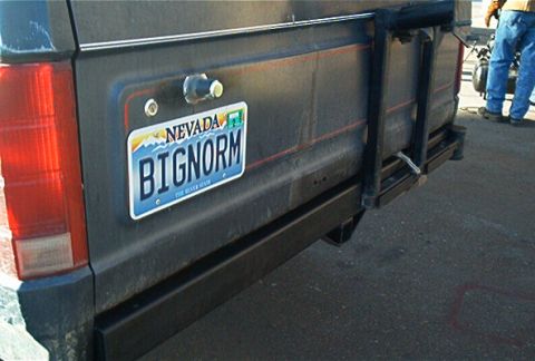 1986 Ford Bronco - The rear of a vehicle shows a Nevada license plate and a heavy-duty aftermarket bumper.