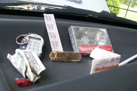 1992 Ford C-350 (Centurion Conversions) - Found hidden behind the ash tray and glove box. A fuse, a straw, a candy bar wrapper, a mini calculator, a $1 bill, 5 $.01 stamps, a nurses…
