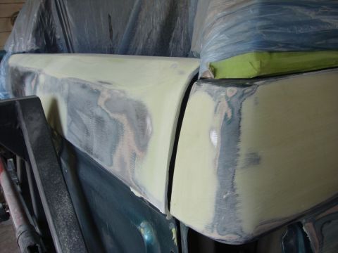 1996 Ford Bronco - Close-up photograph of a vehicle panel sanded and masked during body restoration, not a technical document.