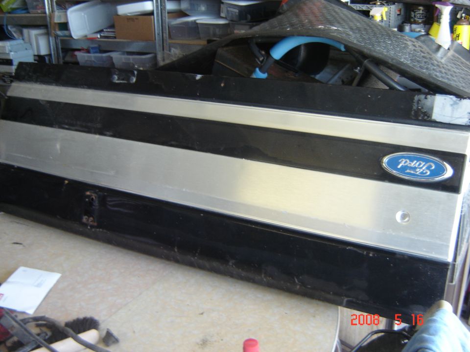 Black and silver tailgate panel with Ford emblem