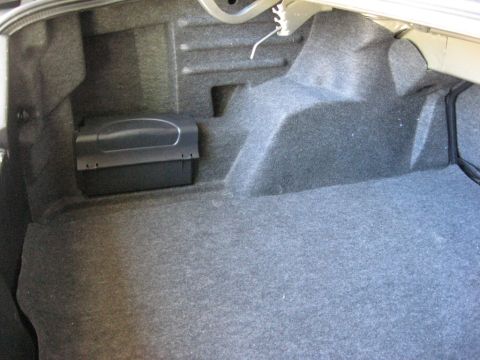 2003 Ford Taurus - Trunk Left, the RCU and CD changer is behind this panel.