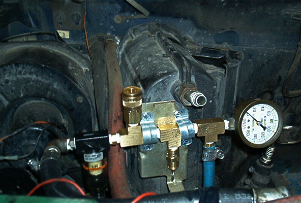 Here is my manifold minus the pressure switch.  It works in this configuration but it helps to have a friend to disconnect the power when the gage gets up there.  :)