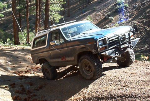 1986 Ford Bronco - This modified Ford Bronco navigates a steep, wooded trail in 2003.