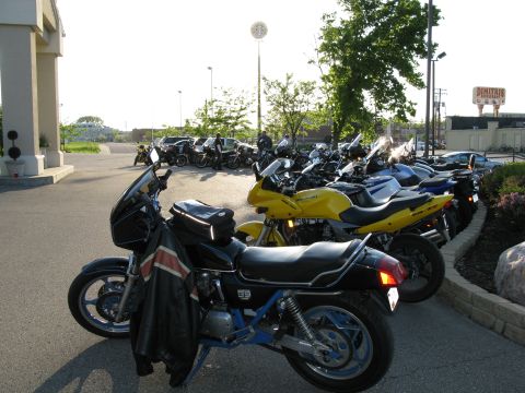 1985 Ford LTD Crown Victoria - Photograph of parked motorcycles, not a technical document.