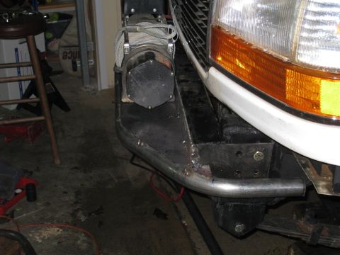 1996 Ford Bronco - Custom bumper with a winch installed, partially visible vehicle front.