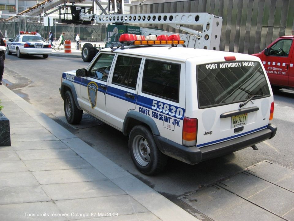 Port Authority Police Jeep Cherokee parked on a city street
