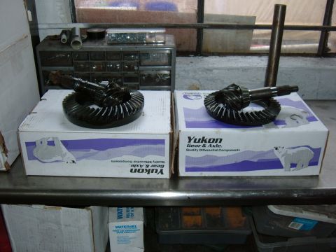 1994 Ford Bronco - Two Yukon Gear & Axle differential gear sets are displayed on top of their respective boxes. The boxes feature a polar bear graphic and tex…