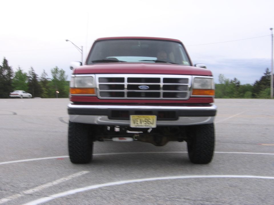 1995 Ford Bronco front view, red color, yellow license plate