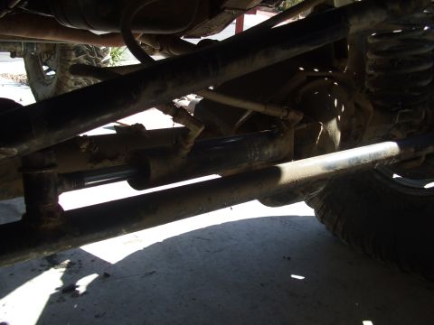 1978 Jeep Cherokee - Close-up view of the undercarriage of a vehicle, showing suspension and steering parts.