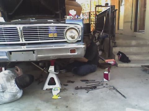 1965 Ford Ranchero - this is a pic of my friend doug and i as we start taking the ranchero apart. My main goal is to get it running and usable. Its not going to…