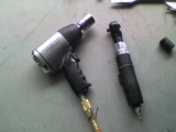1965 Ford Ranchero - A close-up view of two pneumatic tools, an impact wrench and a ratchet, resting on a flat surface.
