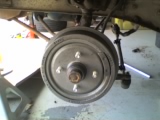 1965 Ford Ranchero - Close-up view of a vehicle's rear drum brake assembly.