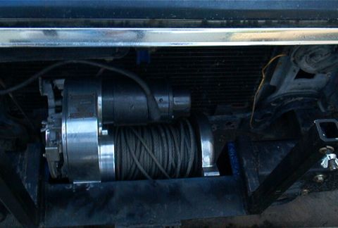 1986 Ford Bronco - A winch assembly is visible in front of the radiator, attached to the vehicle's frame.