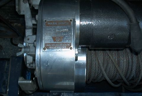 1986 Ford Bronco - Close-up of a Warn winch, showing the model and serial number plate. The registry claims this is from a 1986 Ford Bronco.
