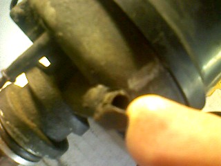 1965 Ford Ranchero - Close-up of a distributor cap and rotor, likely from an older vehicle.