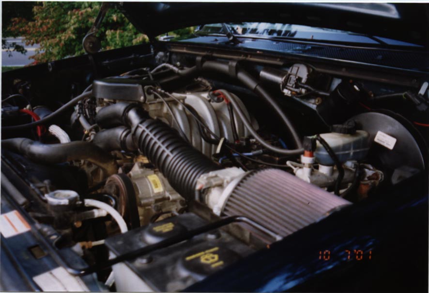 Engine bay with aftermarket air filter and visible hoses. Date stamp reads 10 3 01
