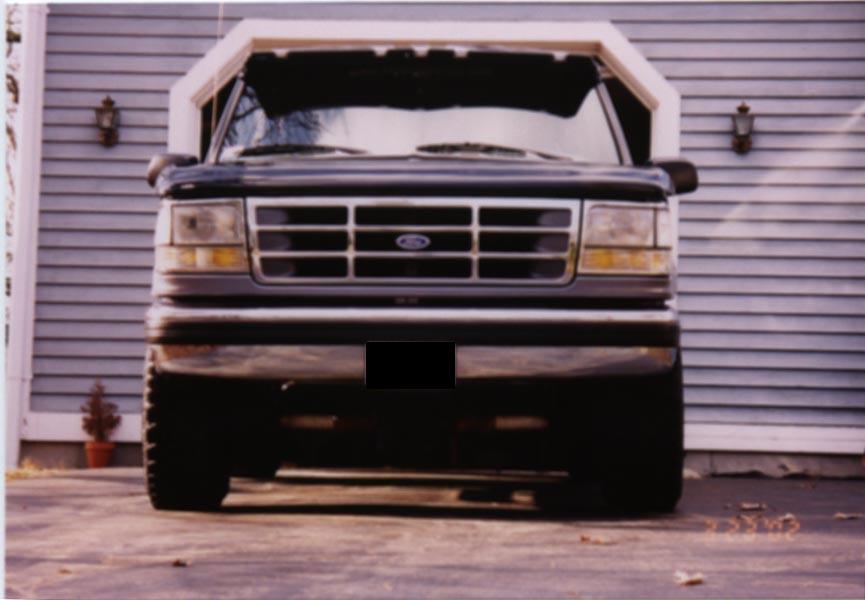 Black 1994 Ford Bronco front view with grille and headlights