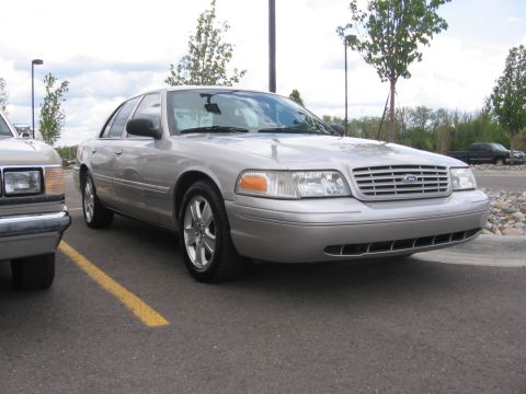 1988 Mercury Grand Marquis - This silver sedan's grille and headlight design indicate a model year significantly later than 1988.