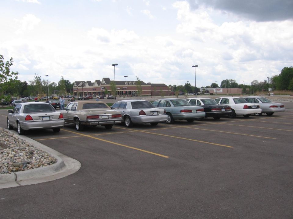 1988 Mercury Grand Marquis sedans parked in a lot, rear view
