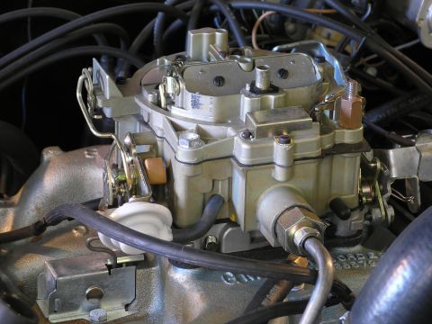 1969 Pontiac Firebird - Close-up of a Holley carburetor, a key engine component for fuel delivery.