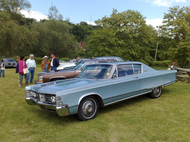 Light blue Chrysler full-size coupe at an outdoor car show