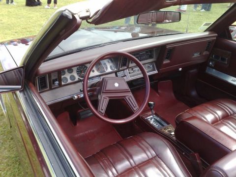 1991 Ford Crown Victoria - Interior view of a maroon convertible showing the dashboard and seats.