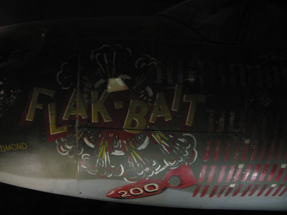 Aircraft nose art reading FLAK-BAIT with mission marks and the number 200