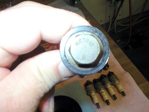 2003 Ford Escape - Yes, it is in fact a metric bolt. I have seen where some folks have suggested using a 9/16" wrench, but in this case on a 2003 model, it's…