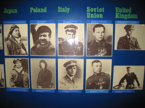 1991 Ford LTD Crown Victoria - blue exhibit board titled with nations Japan, Poland, Italy, Soviet Union and United Kingdom, displaying portraits of WWII flying aces.