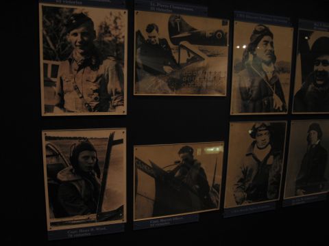 1991 Ford LTD Crown Victoria - Eight framed sepia photographs of WWII airmen, some posed beside or seated in aircraft cockpits, mounted with caption plaques.